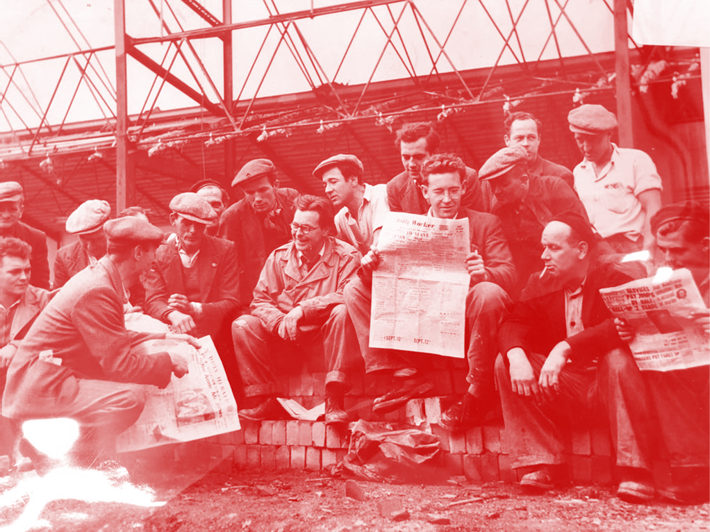 Hosuing construction workers read The Daily Worker